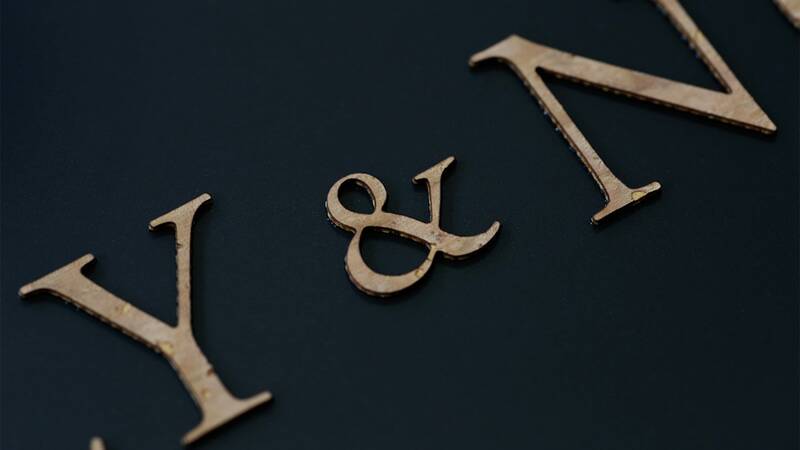 Cork lettering on black background - detailed view