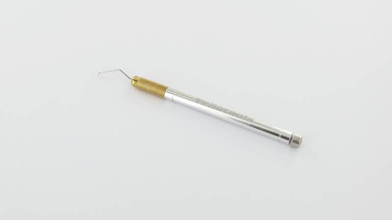 Needle for processing emblems, lettering and labels